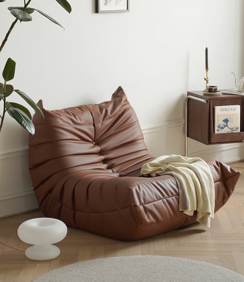 Leather-look slouch couch chair.