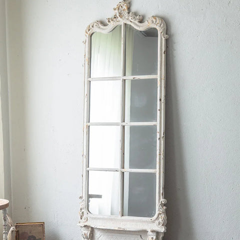 Mirror against wall