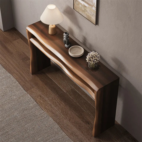 High angle of console table against wall with lamp and ornaments