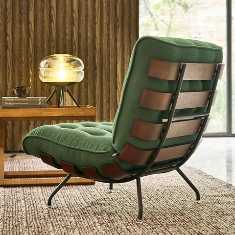 Forrest green chair in living room, showing wooden slates