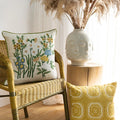 Embroidered pillows on chair