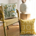 Embroidered pillows on chair