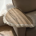 Woven round rugs with tassels.